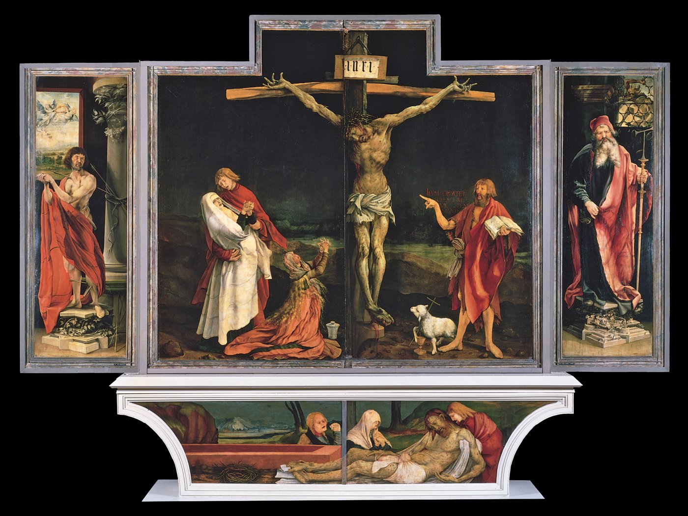 Le retable ouvert : au centre, le Christ crucifié au corps supplicié, entouré de la Vierge, de saint Jean et de Marie-Madeleine