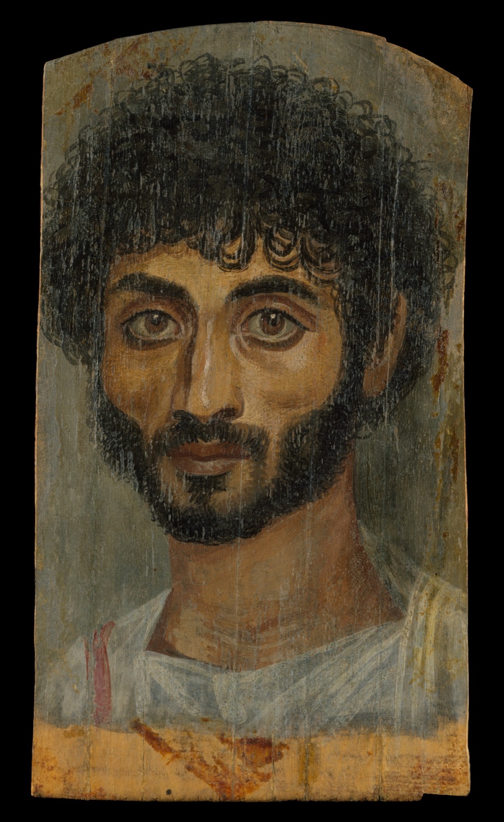 Portrait peint sur bois d'un homme maigre aux cheveux bouclés et à la barbe noire, au regard fixe
